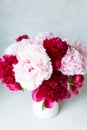 Top view of Vase with bouquet of beautiful peonies on table in room, close-up. Bloom. Peony. Royalty Free Stock Photo