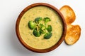 Top View, Vegan Broccoli Cheddar Soup On A Wooden Boardon White Background