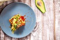 Vegetarian green salad with microgreen and vegetables on wooden white background. Royalty Free Stock Photo