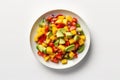 Top View Vegan Mango Salsa With Avocado On White Round Plate On White Background. Generative AI