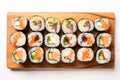 Top View, Vegan Sushi Rolls On A Wooden Boardon White Background