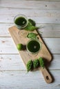 Top view of vegetable juice in a glass on a wooden board Royalty Free Stock Photo