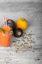 Top view of a veggie smoothie. Zucchinis, pumpkin seeds and juice on a gray background. Vegetarian cooking. Copy space. Royalty Free Stock Photo