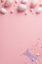 Top view vertical photo of easter decorations glowing confetti easter bunny silhouettes lilac pink and white easter eggs on