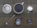 Top view of vietnamese coffee filter ingredients with ready cup of coffee on bamboo placemat Royalty Free Stock Photo