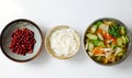 Top view Vietnamese vegan cuisine, family meal, vegetables sour soup, fried peanut with soy sauce and rice bowl for lunch