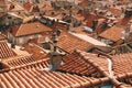 Top view of the village of houses with orange roofs and old chimneys. Royalty Free Stock Photo