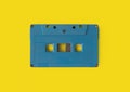 Top view of vintage audio tape cassette isolated on yellow background. 1980s recorder. Old pop music. album collection Royalty Free Stock Photo