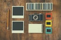 Top View Of Vintage Camera And Old Slides Frames Over Wooden Table Background