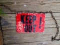 Top view of vintage Keep Out sign on wooden deck Royalty Free Stock Photo