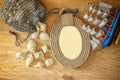 Top view of vintage nautical frame from ropes, wooden boat and natural seashells on wooden table