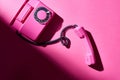 Top view of vintage pink telephone with shadow