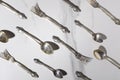 Top view of vintage spoons and forks on the white marble table.Bright light and shadows Royalty Free Stock Photo