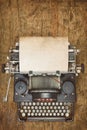 Vintage typewriter with empty sheet of paper