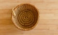 Top view of vintage weave wicker basket isolated on wood table Royalty Free Stock Photo