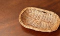 Top view of vintage weave wicker basket isolated on wood table Royalty Free Stock Photo