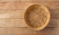 Top view of vintage weave wicker basket isolated on wood table Royalty Free Stock Photo