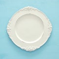 Top view of vintage white empty plate. Flat lay. Royalty Free Stock Photo