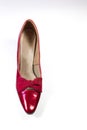 Top view of a vintage woman`s shoe in ruby red pleather, on white Royalty Free Stock Photo