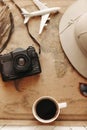 Top view of vintage world map with objects related to journey, excursions and tours Royalty Free Stock Photo