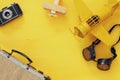 Top view of vintage yellow toy plane, old photo camera Royalty Free Stock Photo