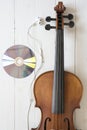 top view of violin earphone and dvd disc Royalty Free Stock Photo