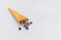 Top view of waffle cone with frozen blackberries Royalty Free Stock Photo