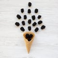 Top view waffle sweet ice cream cone with blackberries on a white wooden table. Flat lay, overhead Royalty Free Stock Photo