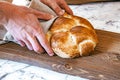 Homemade Jewish traditional challah bread on rustic wooden cutting board