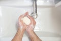Top view washing of male hands soap foam water
