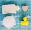 Top view of washing sponge, soap and ruber duck