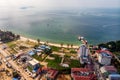 Top view of wasteland by the sea and buildings under construction in Sihanoukville, Cambodia