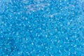 Top view of water ripples on blue mosaic tiled. bottom of swimming pool. background Royalty Free Stock Photo
