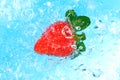 Top view of a water splash on a strawberry Royalty Free Stock Photo