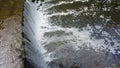 Top view of waterfall cascading on the River Almond in Cramond, Midlothian, Scotland