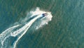 Top view waverunner rider crossing the sea.