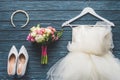 top view of wedding bouquet and dress on wooden dark Royalty Free Stock Photo