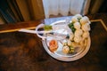 Top view of wedding bouquet of white flowers and ribbon on plate. Horizontal shot. Wedding atributes. Close up. Floral Royalty Free Stock Photo