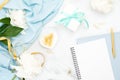 Top view wedding woman accessories on marble background. Minimal flat lay style composition with golden clips, white peony flowers Royalty Free Stock Photo