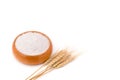 Top view of wheat flour in wooden bowl and rice ears isolated on white background Royalty Free Stock Photo