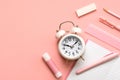 Top view of white alarm clock and school supplies with copy space for text. Back to school concept Royalty Free Stock Photo