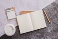 Top view white binder blank notebook or diary or journal for writing text and message with pencil and coffee cup on concrete Royalty Free Stock Photo