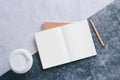 Top view white binder blank notebook or diary or journal for writing text and message with pencil and coffee cup on concrete Royalty Free Stock Photo