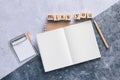 Top view of white binder blank notebook or diary or journal for writing text and message with pencil on concrete background with Royalty Free Stock Photo