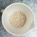 Top view of a white bowl of white beans