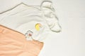 Top view of a white top with a brooch and a pink skirt. Royalty Free Stock Photo