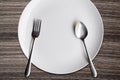 Top view White dish spoon fork on wood background Royalty Free Stock Photo