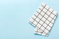 top view with white empty kitchen napkin isolated on table background. Folded cloth for mockup with copy space, Flat lay Royalty Free Stock Photo