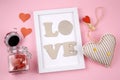 White frame with letters L O V E , heart and jar with hearts Royalty Free Stock Photo