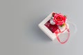 Top view of white gift box with red rose and bauble on silver background. Christmas Horizontal banner with copy space Royalty Free Stock Photo